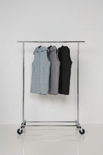 Load image into Gallery viewer, Caju Puffer Vest Geometric Panels with Removable Hood Grey colour in a rack

