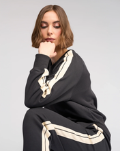 Load image into Gallery viewer, Knewe Label - Rebel Jumper - Slate colour sitting shot
