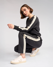 Load image into Gallery viewer, Knewe Label - Rebel Pant - Slate colour sitting shot
