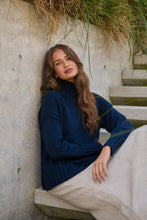 Load image into Gallery viewer, Naturals by O&amp;J Ribbed Turtleneck Jumper Ink colour sitting shot
