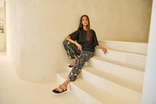 Load image into Gallery viewer, Naturals by O&amp;J Roundneck Linen Top Black colour sitting shot

