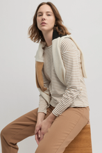 Load image into Gallery viewer, Yarra Trail - Division Tee - Ecru/ Cinnamon colour sitting shot

