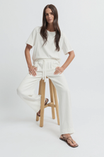 Load image into Gallery viewer, Yarra Trail - Entwine Pant - Ecru colour sitting shot
